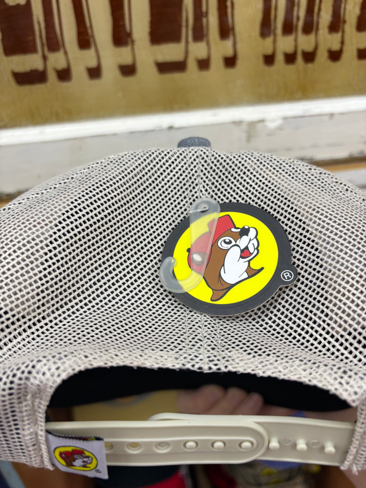 Buc-ees Adult Blue, Beige and White Ball Cap with Brown Leather Logo on Front and Adjustable Strap