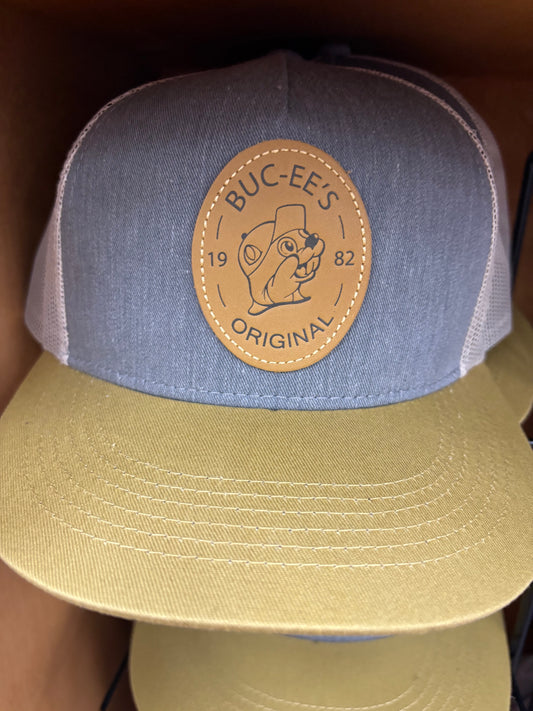 Buc-ees Adult Blue, Beige and White Ball Cap with Brown Leather Logo on Front and Adjustable Strap